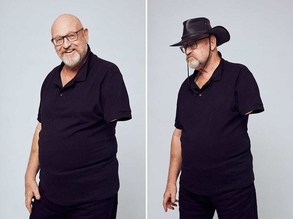 Personal branding photography of a man in his 60's with a black, leather cowboy hat and glasses dressed in all black. Shot in studio in Cape Town, South Africa