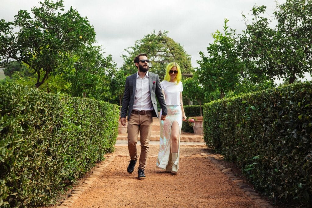 Elopement photography of a rock n roll, quirky bride and groom in a garden in Cape Town, South Africa