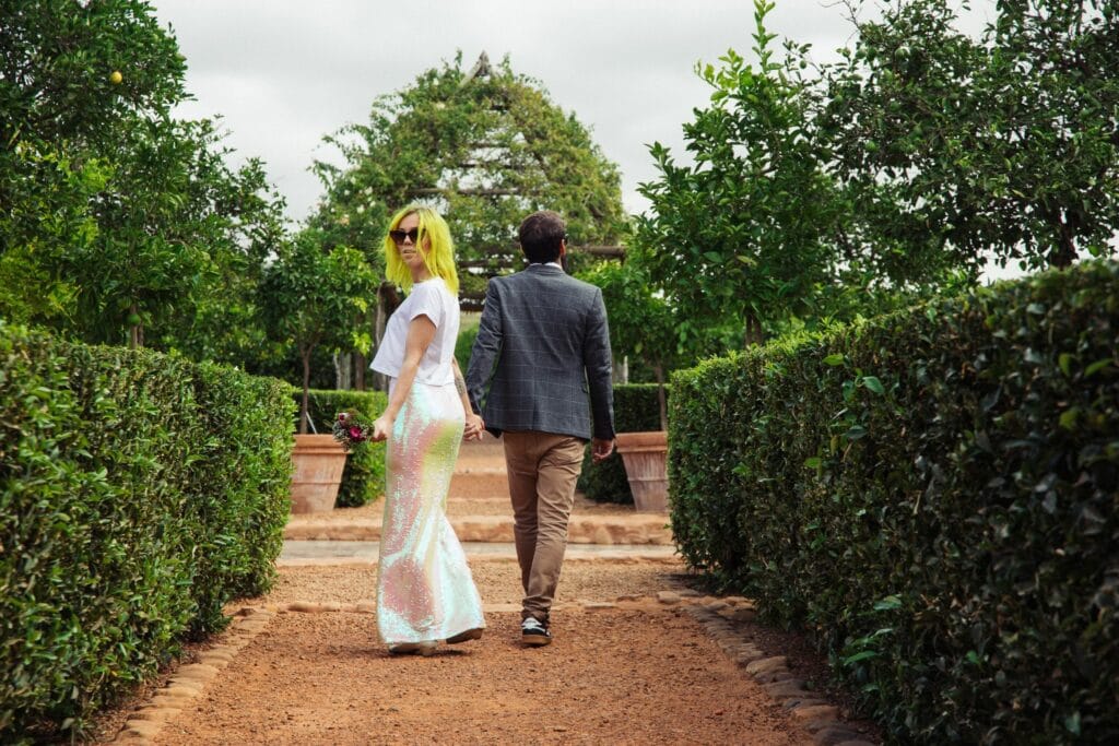 Elopement photography of a rock n roll, quirky bride and groom in a garden in Cape Town, South Africa