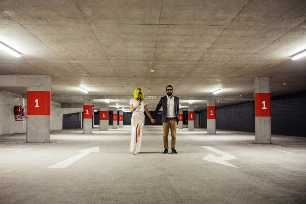 Elopement photography of a rock n roll, quirky bride and groom in a car park in Cape Town, South Africa